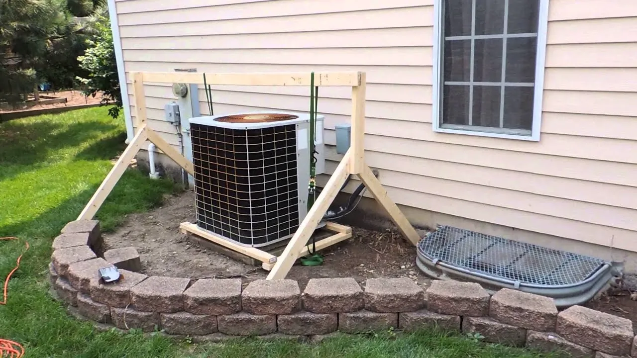 Air conditioning condenser unit beside house